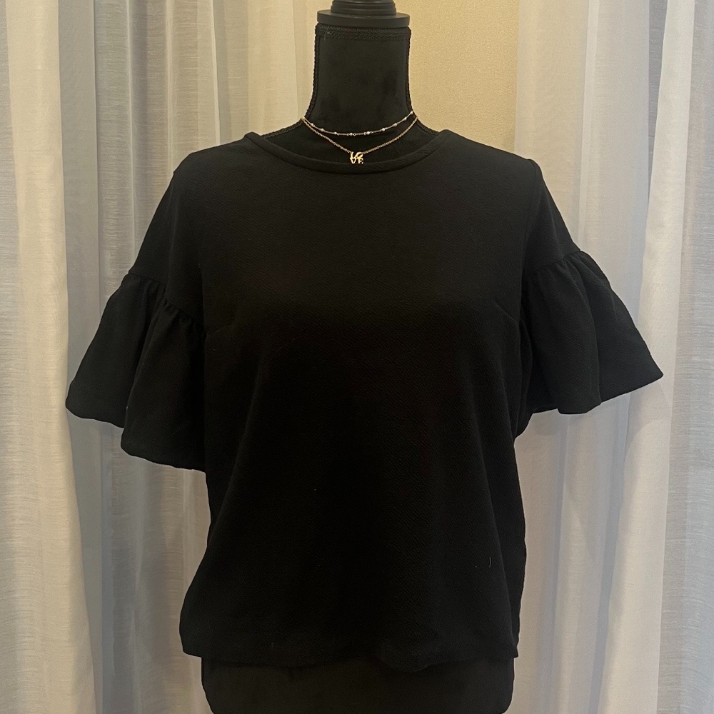 Black top with puff sleeves